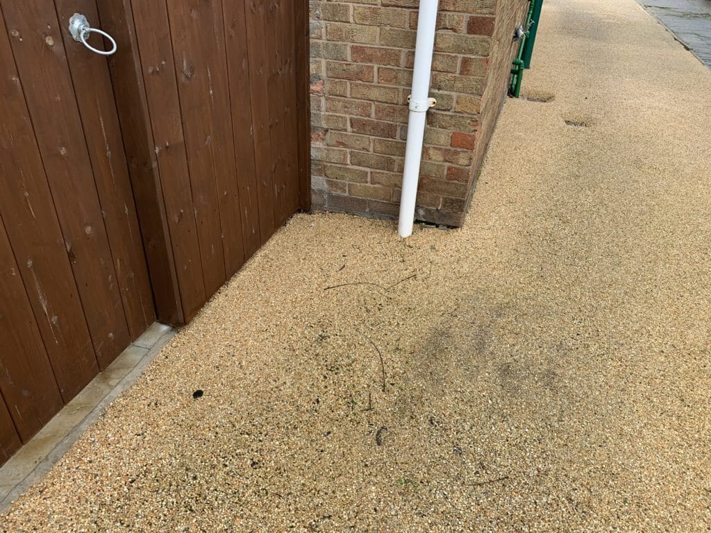 Loose stones on faulty resin driveway